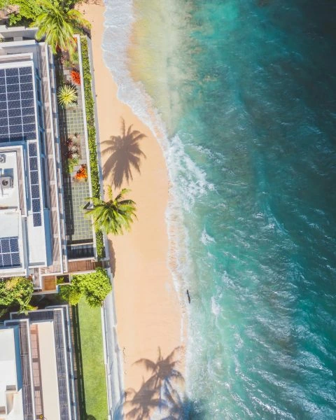 Tripower Australia houses with solar power panels by the beach
